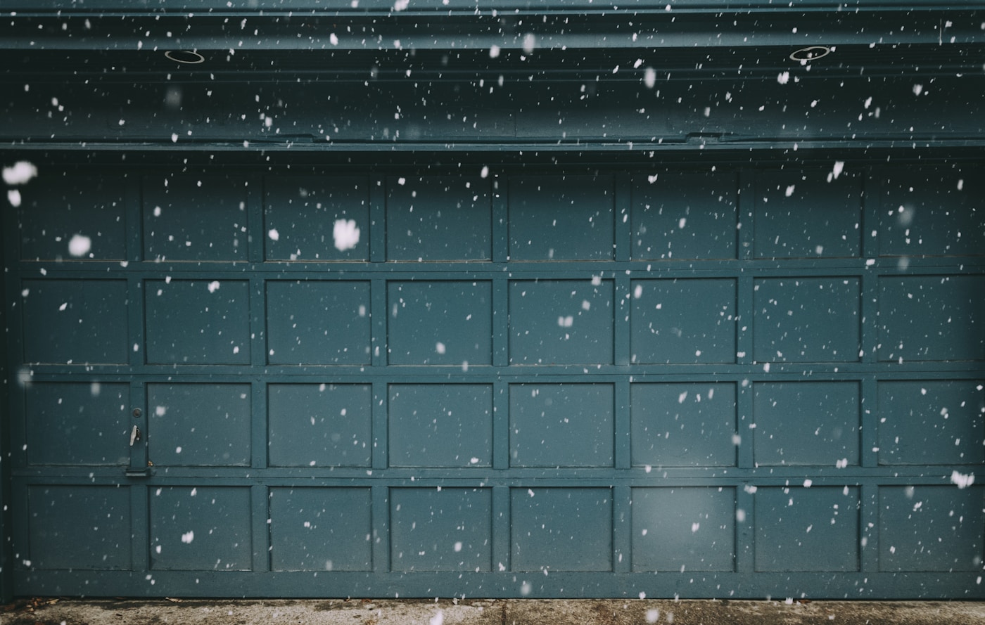 Closed residential garage door during cold winter weather