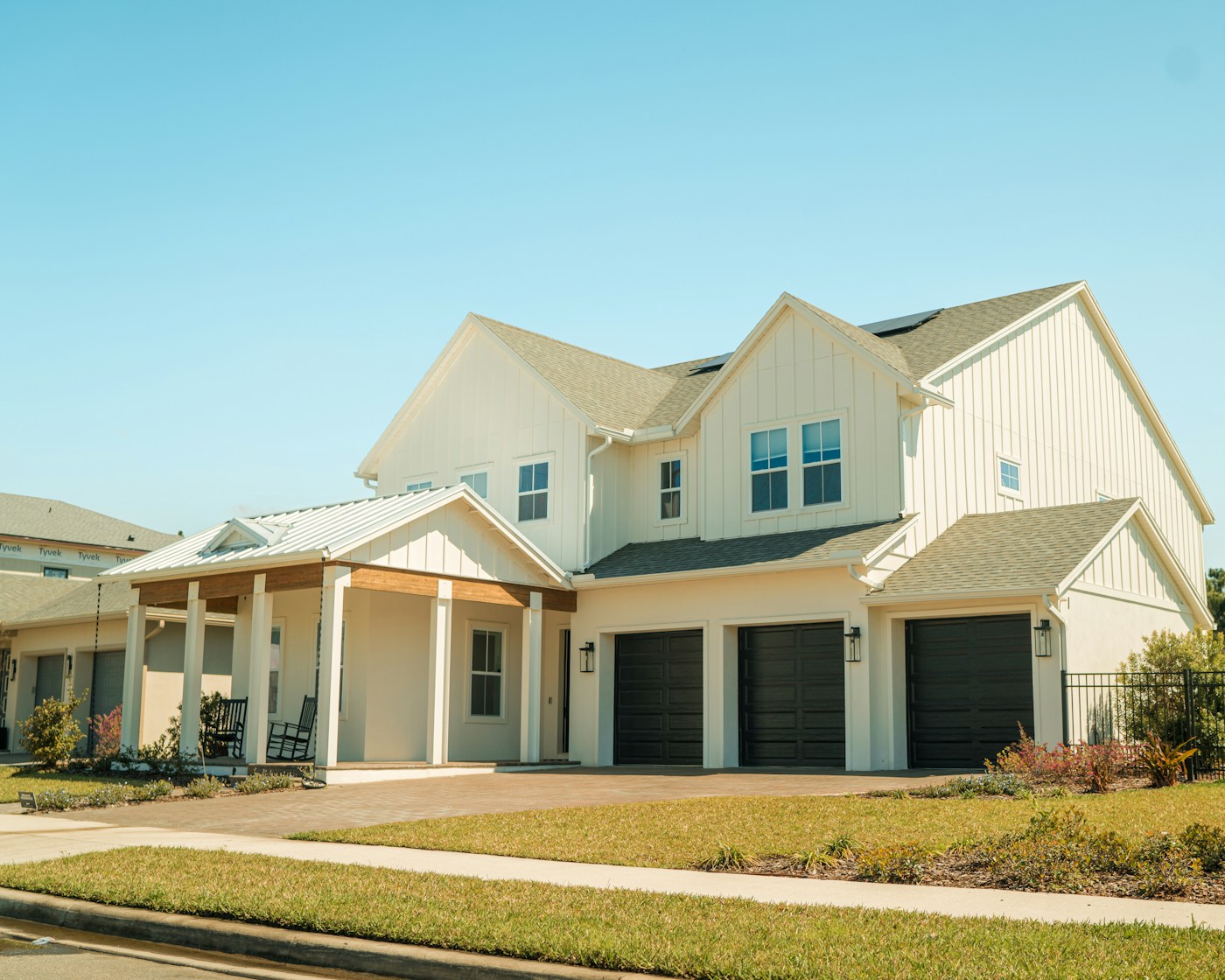 House exterior with two insulated garage doors